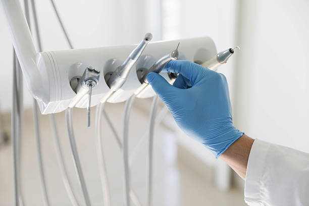 Professional Tooth Extraction technician working in Des Moines, IA